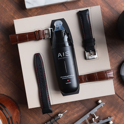 Luxury watch accessory flat lay featuring the AIS Collective ChronoLeatherPen on it's premium box alongside with leather straps.
