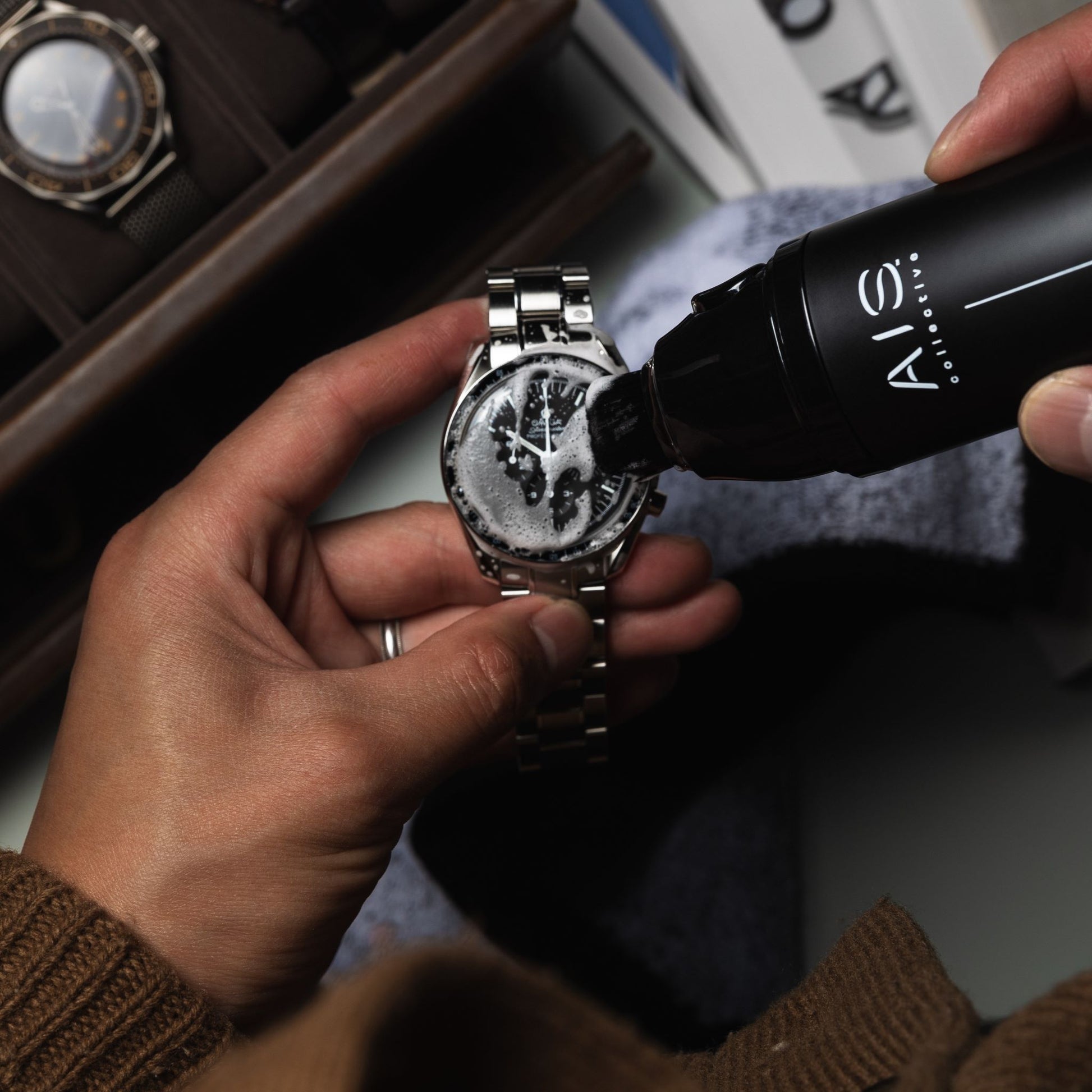 a man cleaning a ChronoPen Swiss Rolex watch, using the ChronoPen
