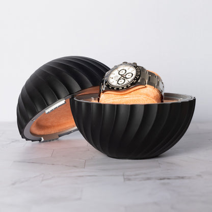 A luxury Rolex watch securely displayed in an open black ChronoSphere watch holder with a Salmon interior.
