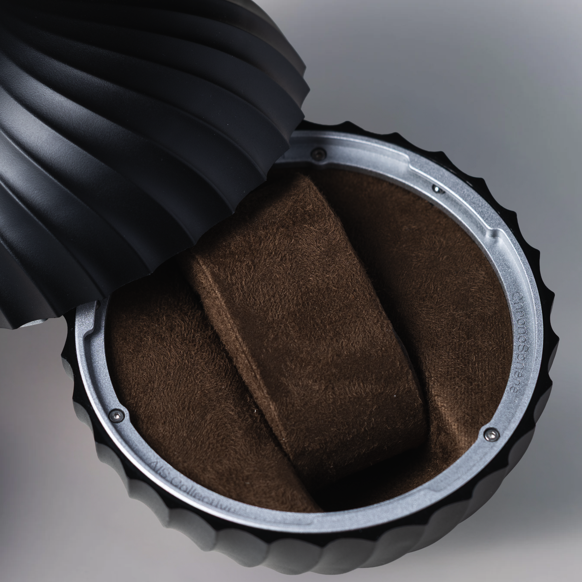 ChronoSphere Midnight Forest luxury watch container with an open shell showing the velvet interior.