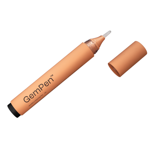 GemPen, the ultimate jewellery cleaning accessory, with an open cap, showing the soft brush, especially developed to reach every spot of fine jewellery